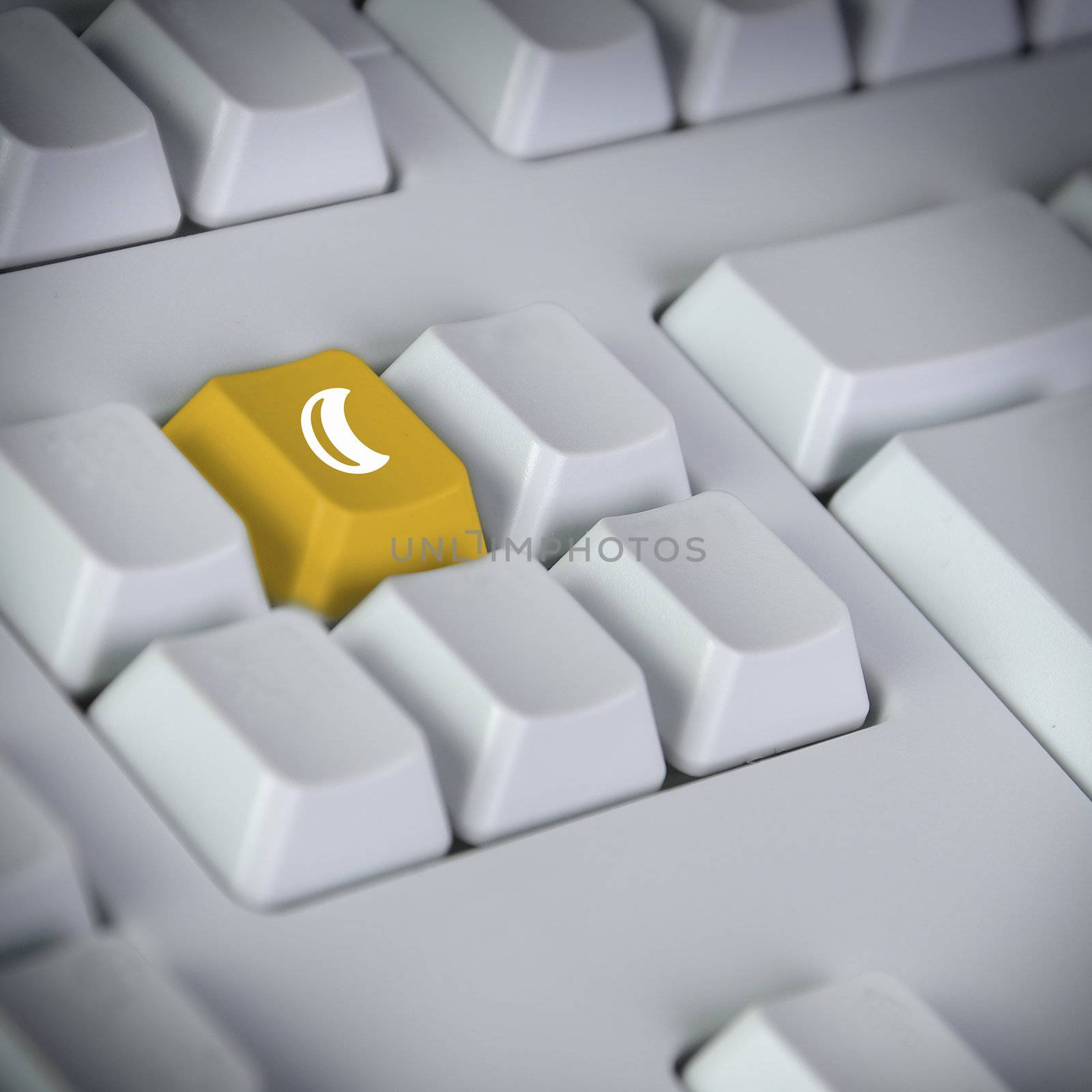 detail of keyboard with key showing moon