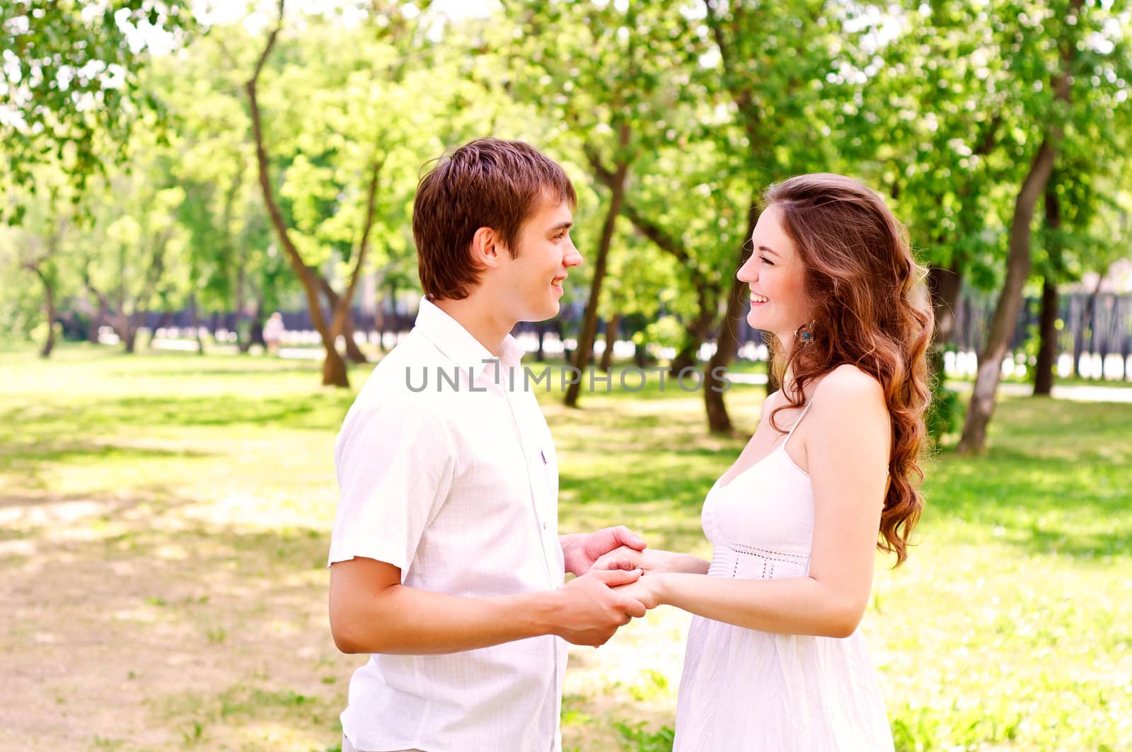 couple holding hands in the park, spending time with loved ones