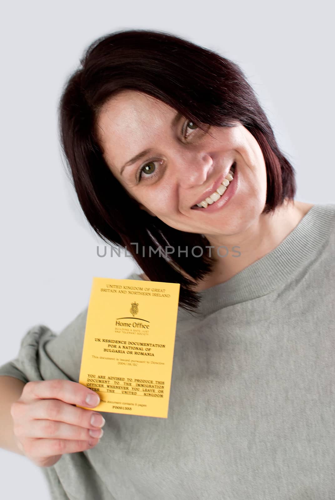 bulgarian immigrant holding uk work permission card for bulgarians and romanians