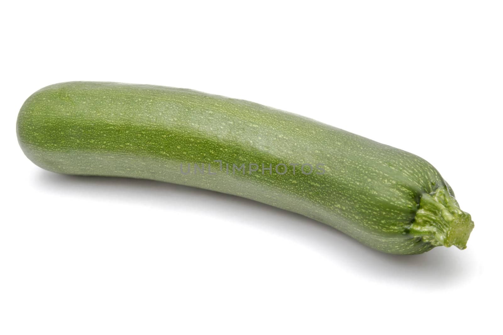 green zucchini closeup on white background