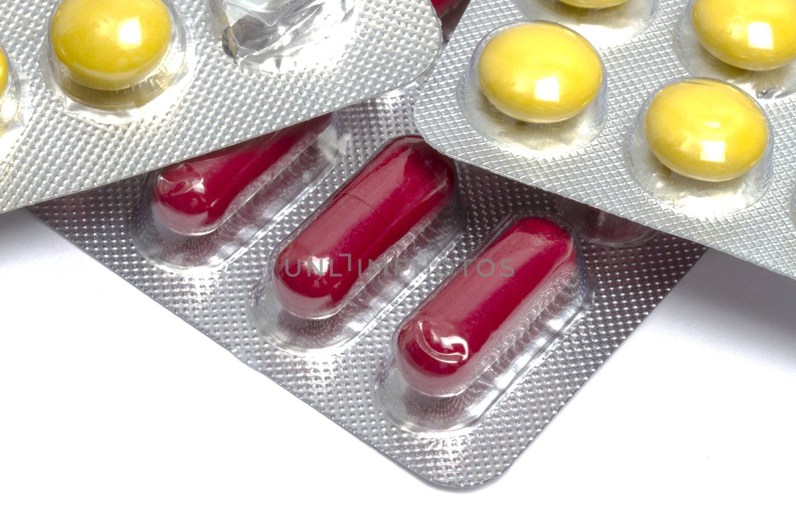 Colorful pills closeup on white background 