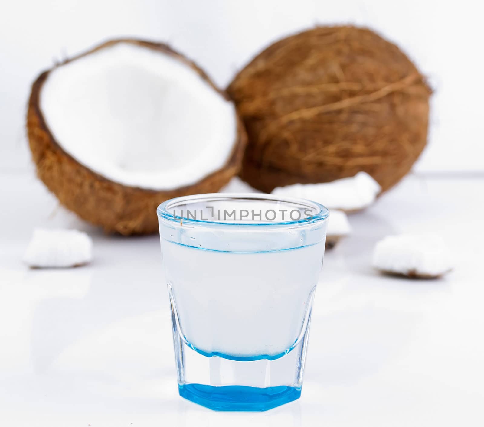 freshly cut coconut and milk isolated on white background