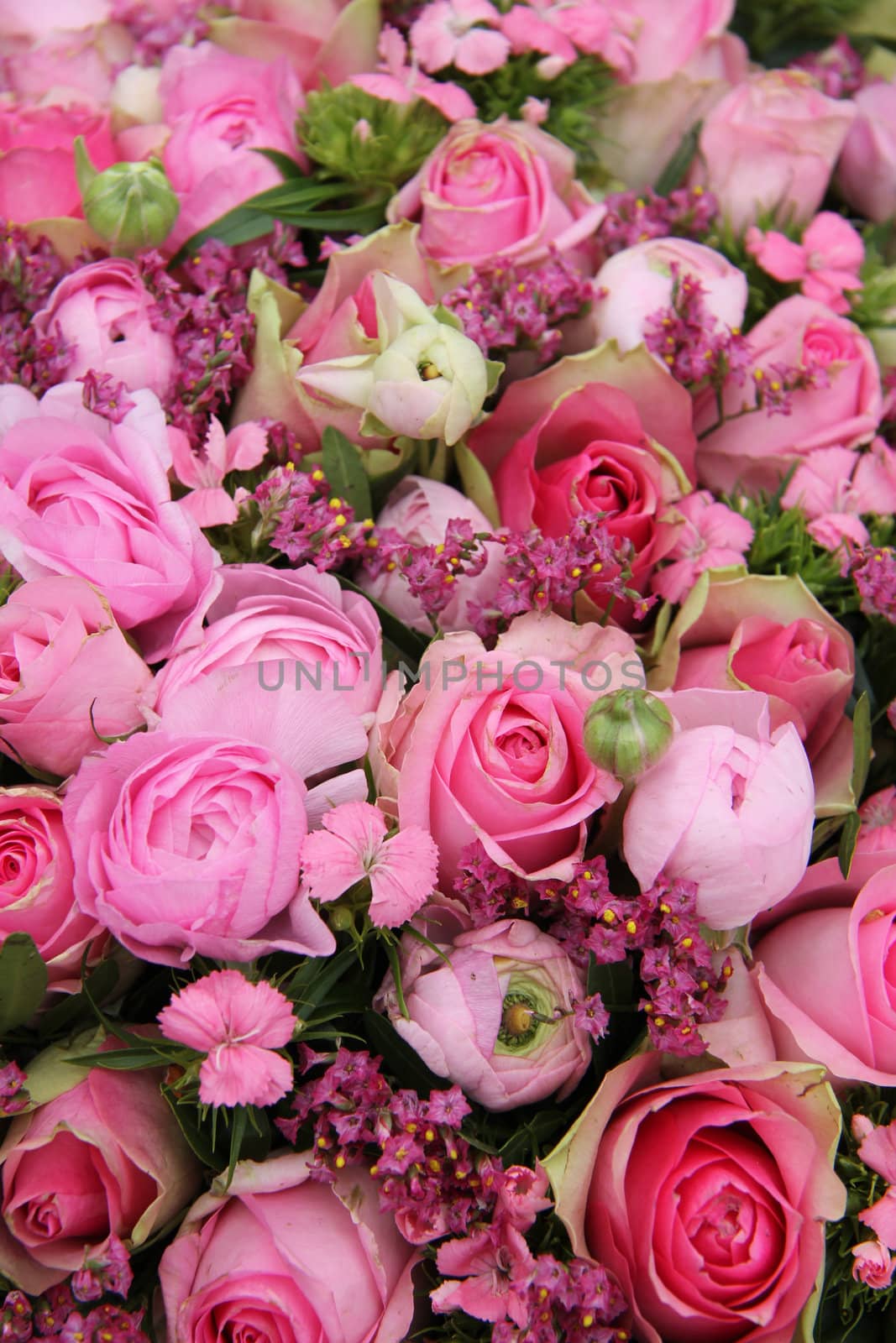 Mixed pink flower arrangement by studioportosabbia