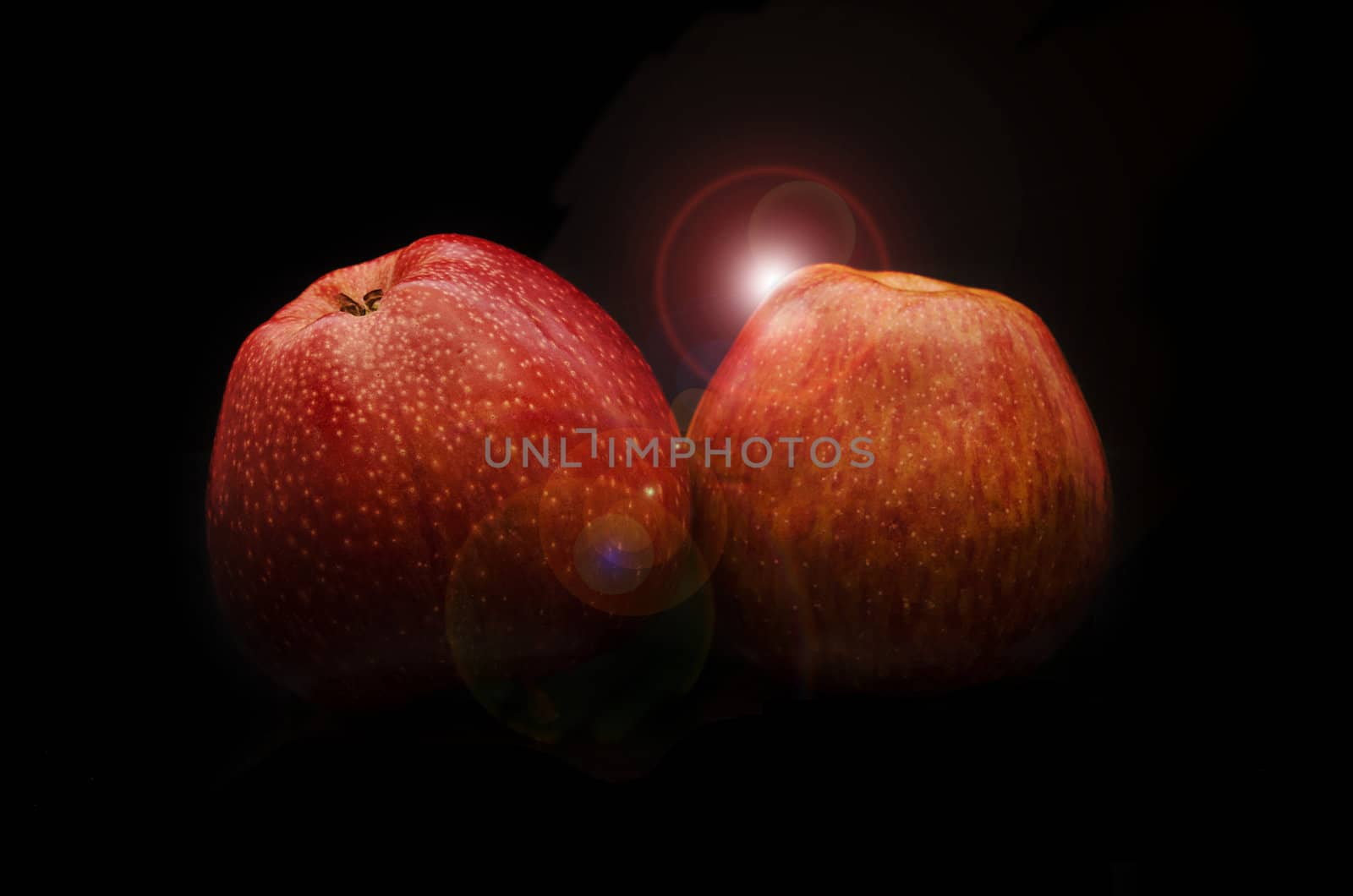 Pair of red apple with  beautiful shiny effect, and without flash reflection