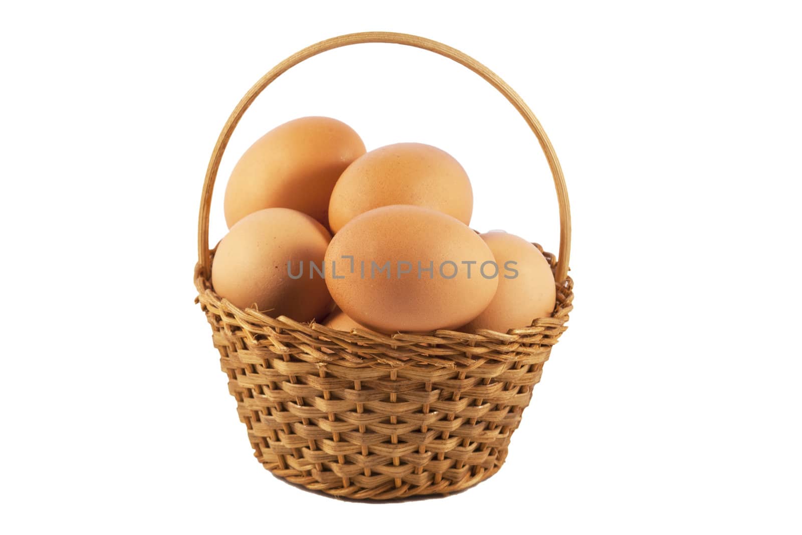 Eggs in a basket over white isolated background