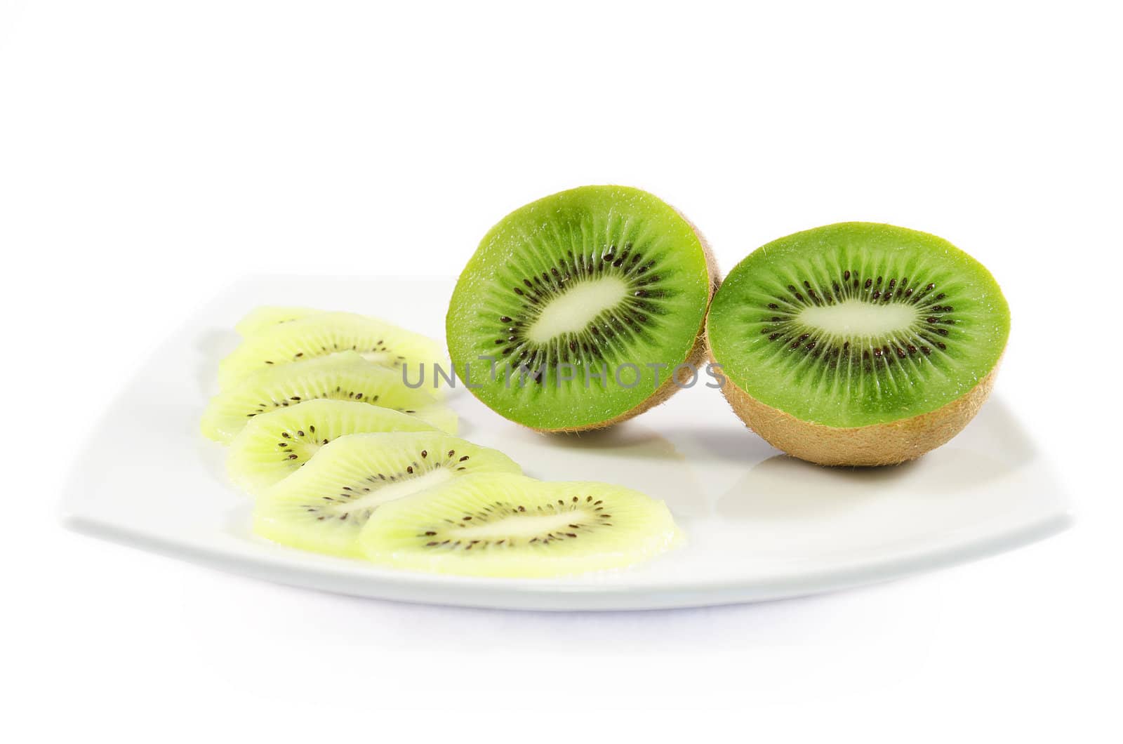 Kiwi fruit and slices over white isolated background by HERRAEZ