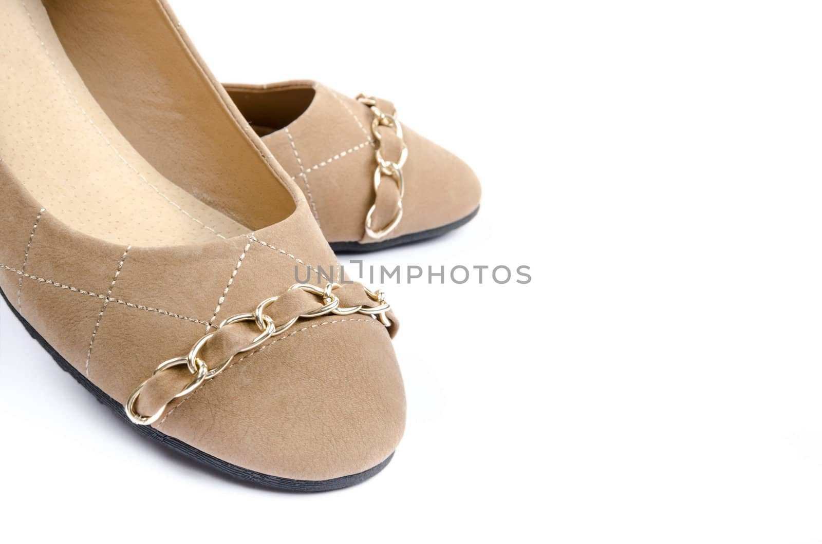 Pair of brown shoes isolated on a white background