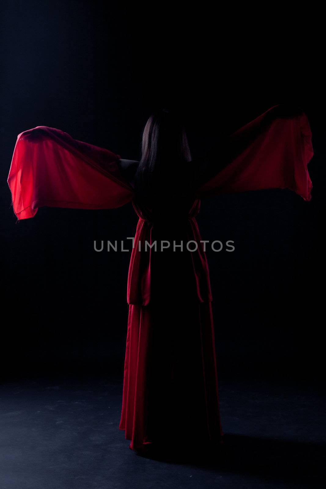 Young girl dancer in a darkness before start
