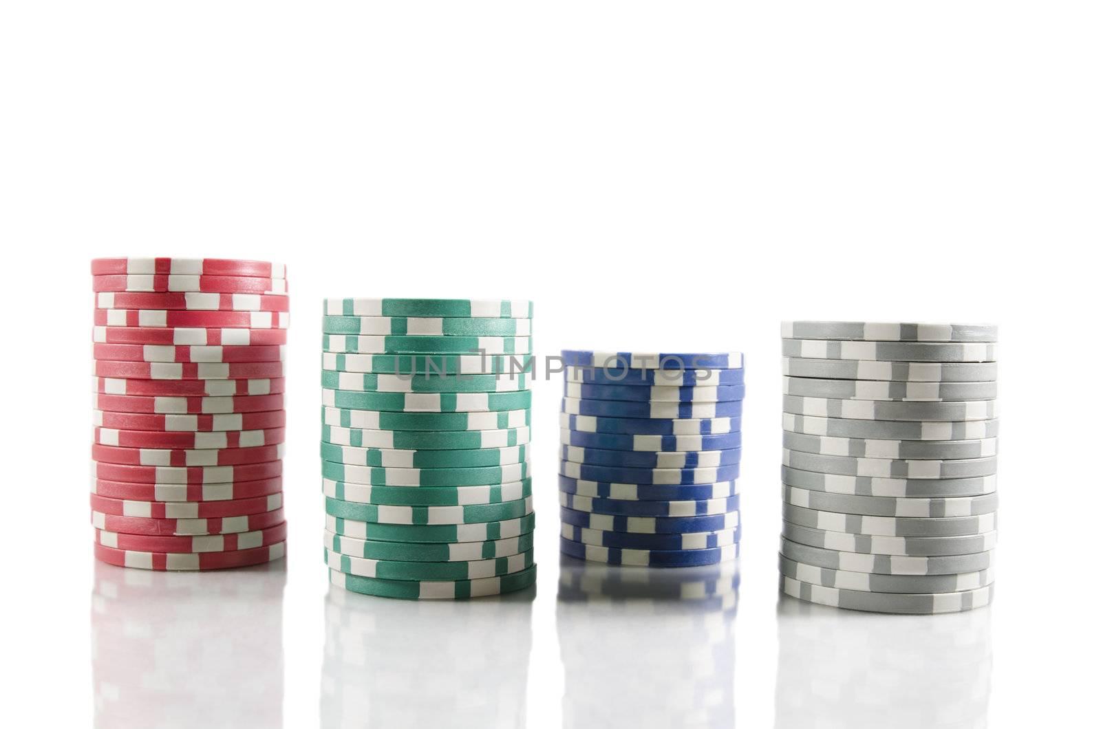 Stack of poker chips. Red, blue,green, and grey chips over white isolated background. by HERRAEZ