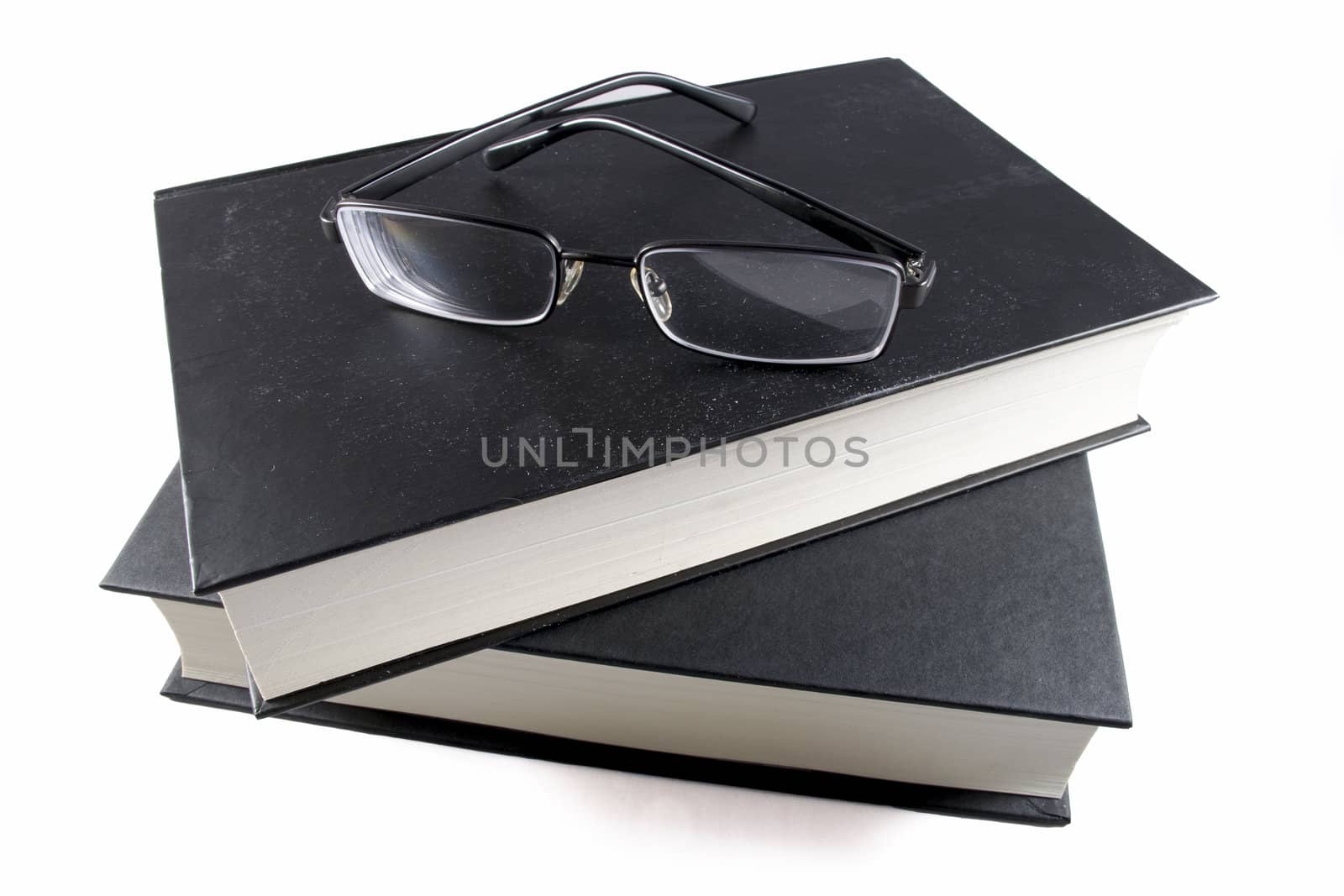 Book and glasses  isolated on white background