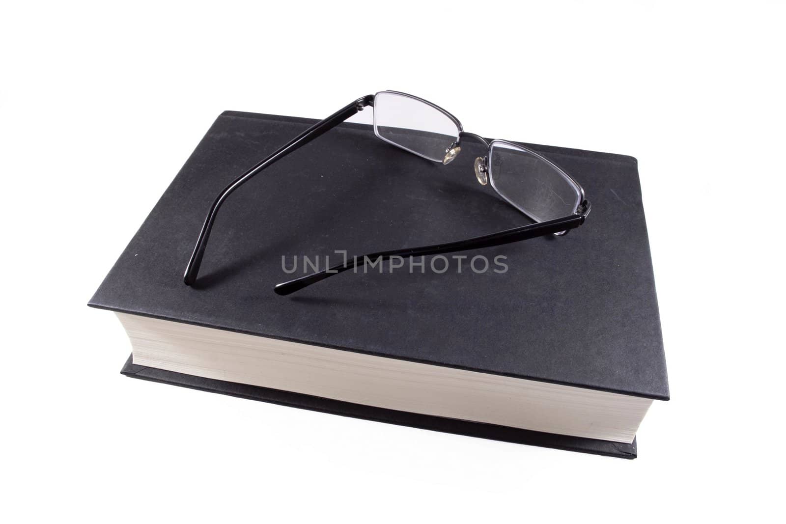 Book and glasses by HERRAEZ