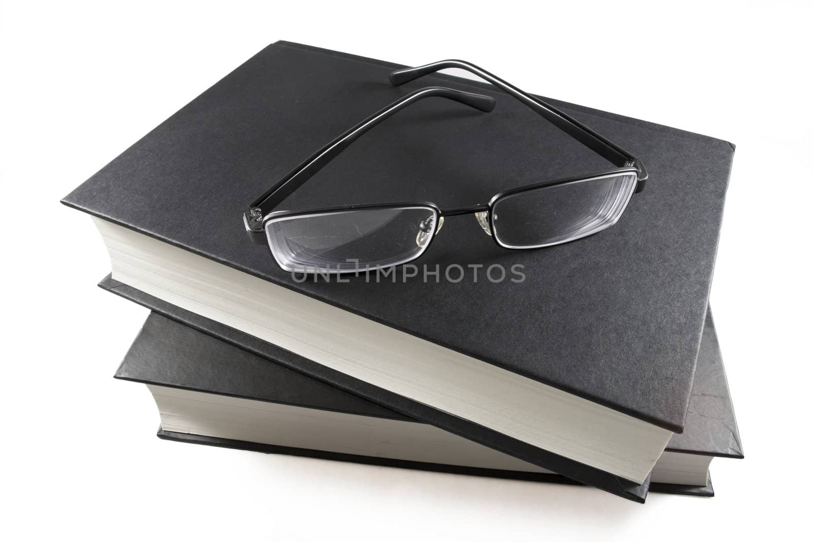 Book and glasses  isolated on white background