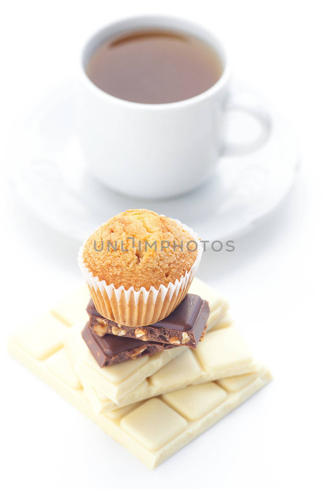 bar of chocolate,tea and muffin isolated on white by jannyjus