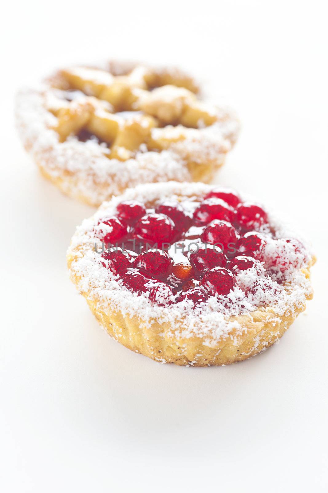 beautiful cake with berries on a white background