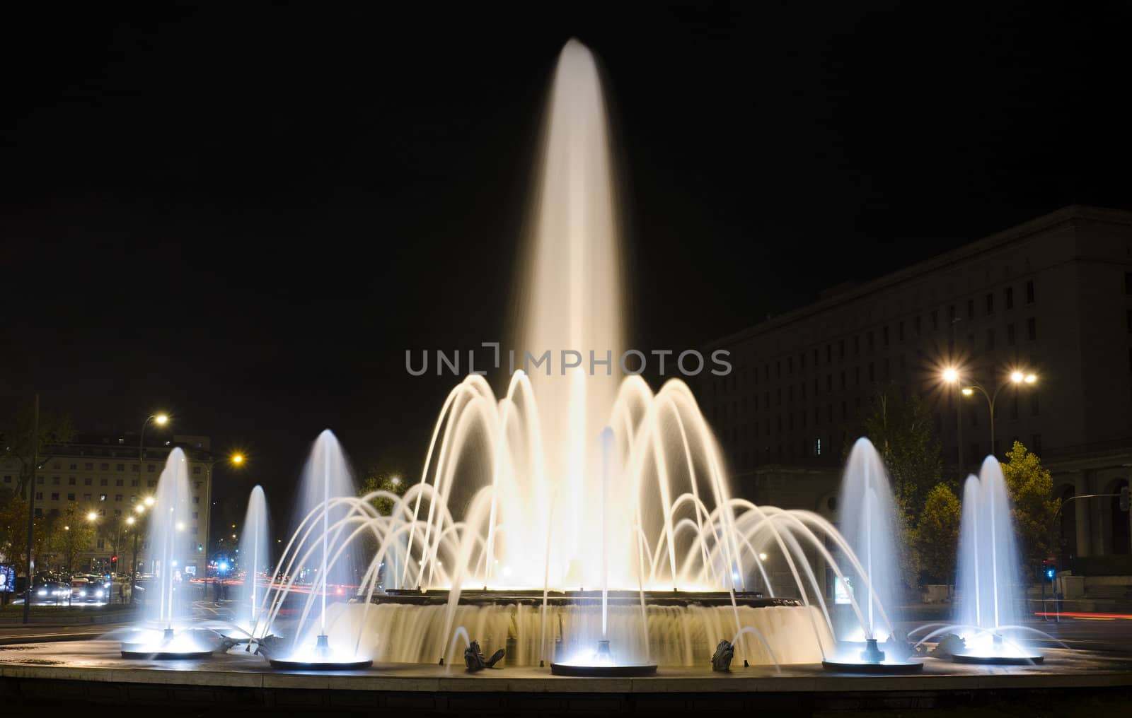 Fountain at night in la Castellana street Madrid Spain by HERRAEZ