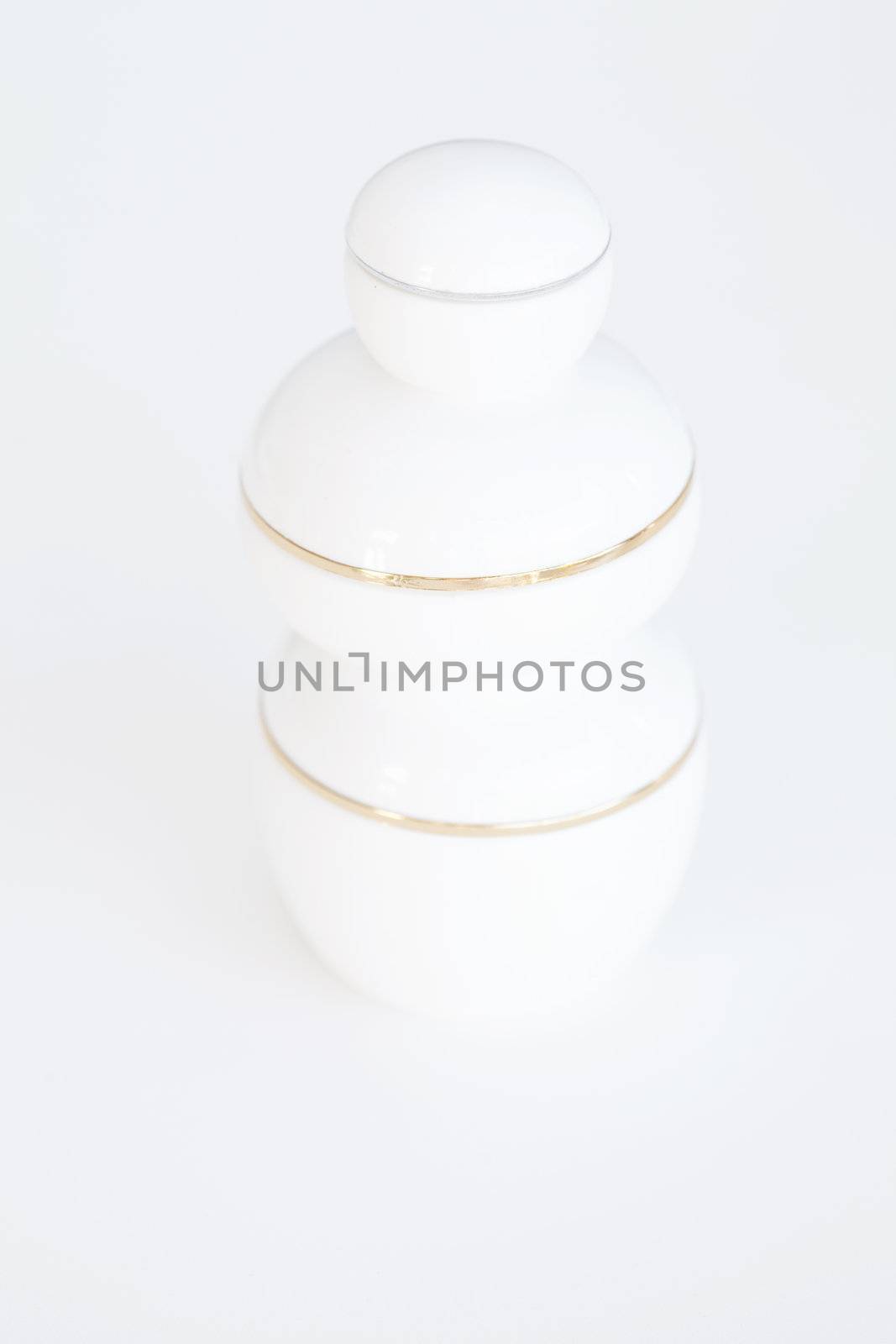 three cosmetic containers on white background by jannyjus