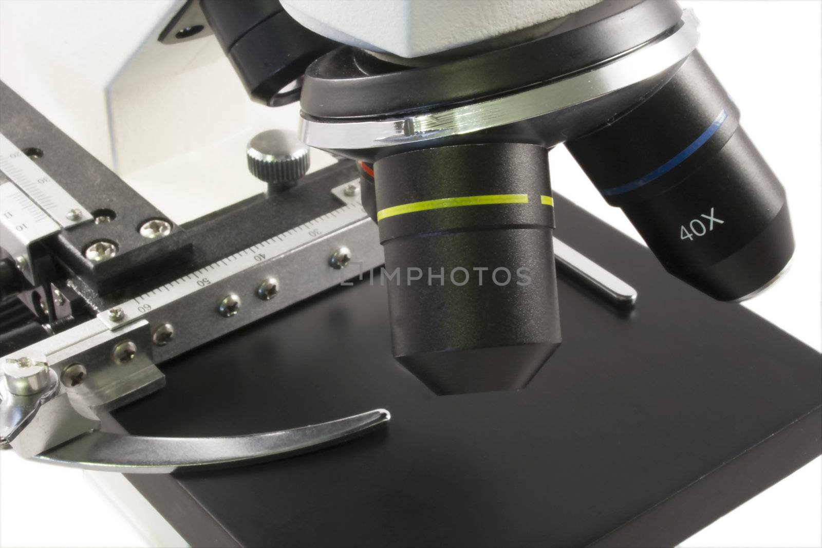 Close up view of a Microscope over white isolated background