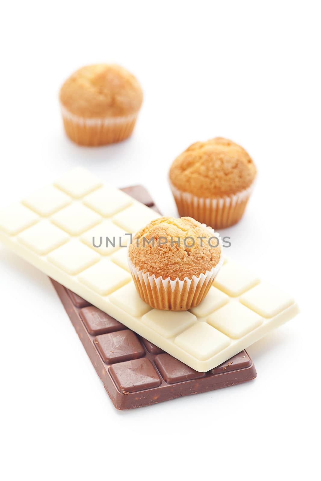 bar of chocolate and muffin isolated on white by jannyjus