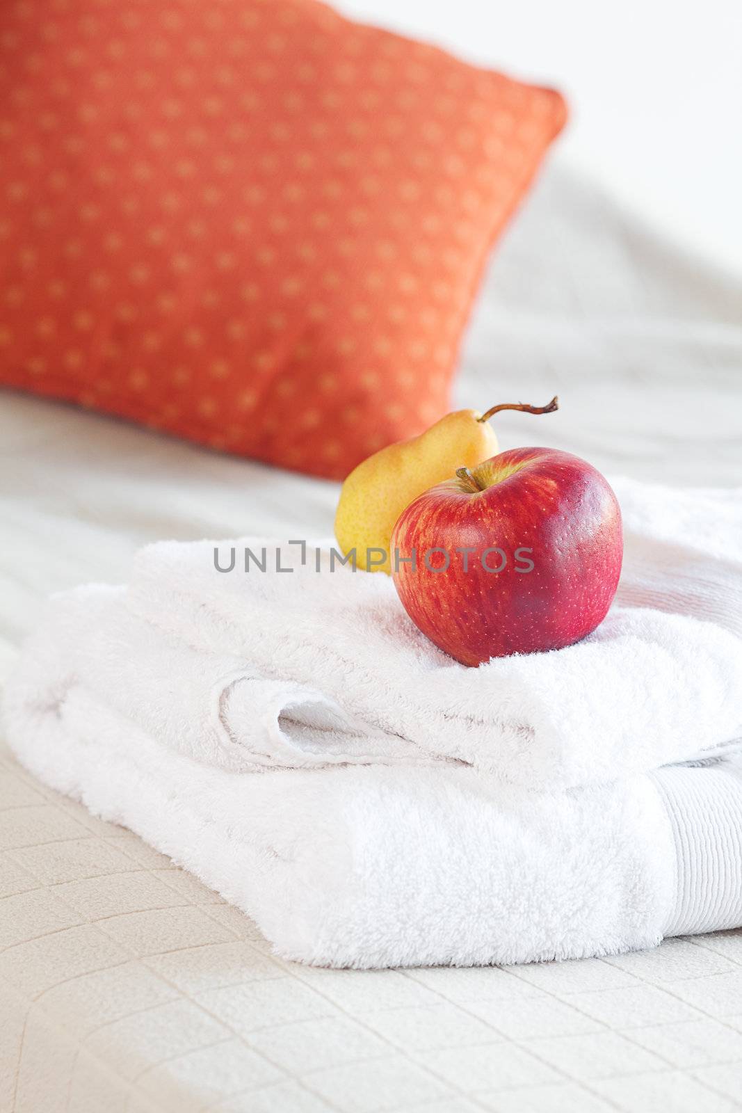 cup of tea,apple and pear on the bed