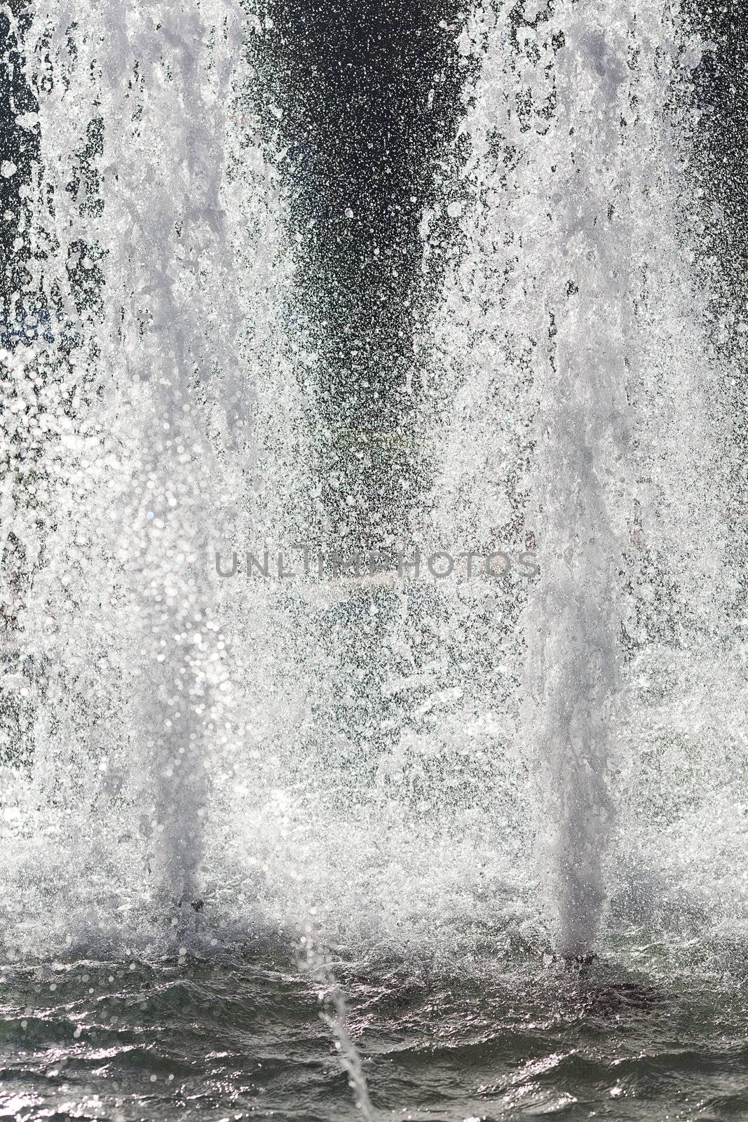 splashing water of fountain in sunlight by jannyjus