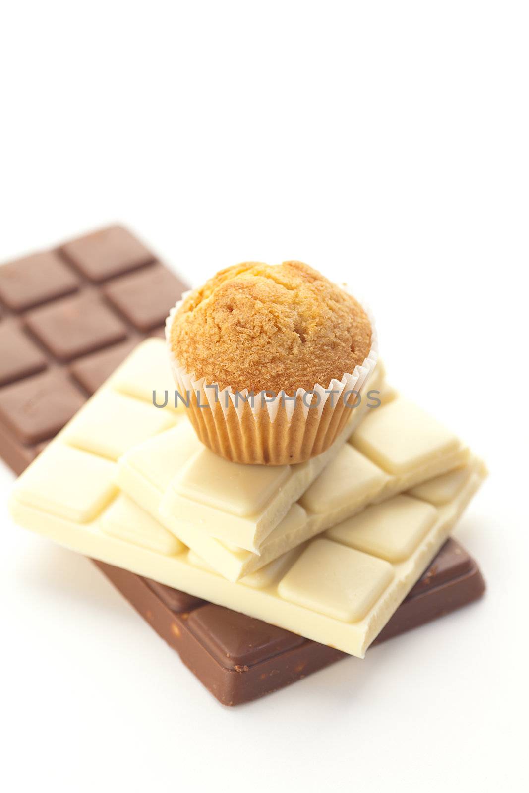 bar of chocolate and muffin isolated on white by jannyjus