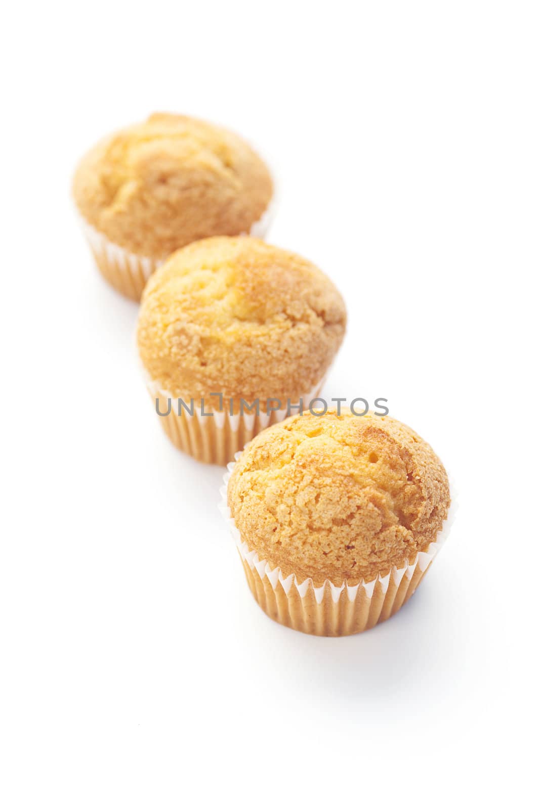 three  muffins  isolated on white by jannyjus