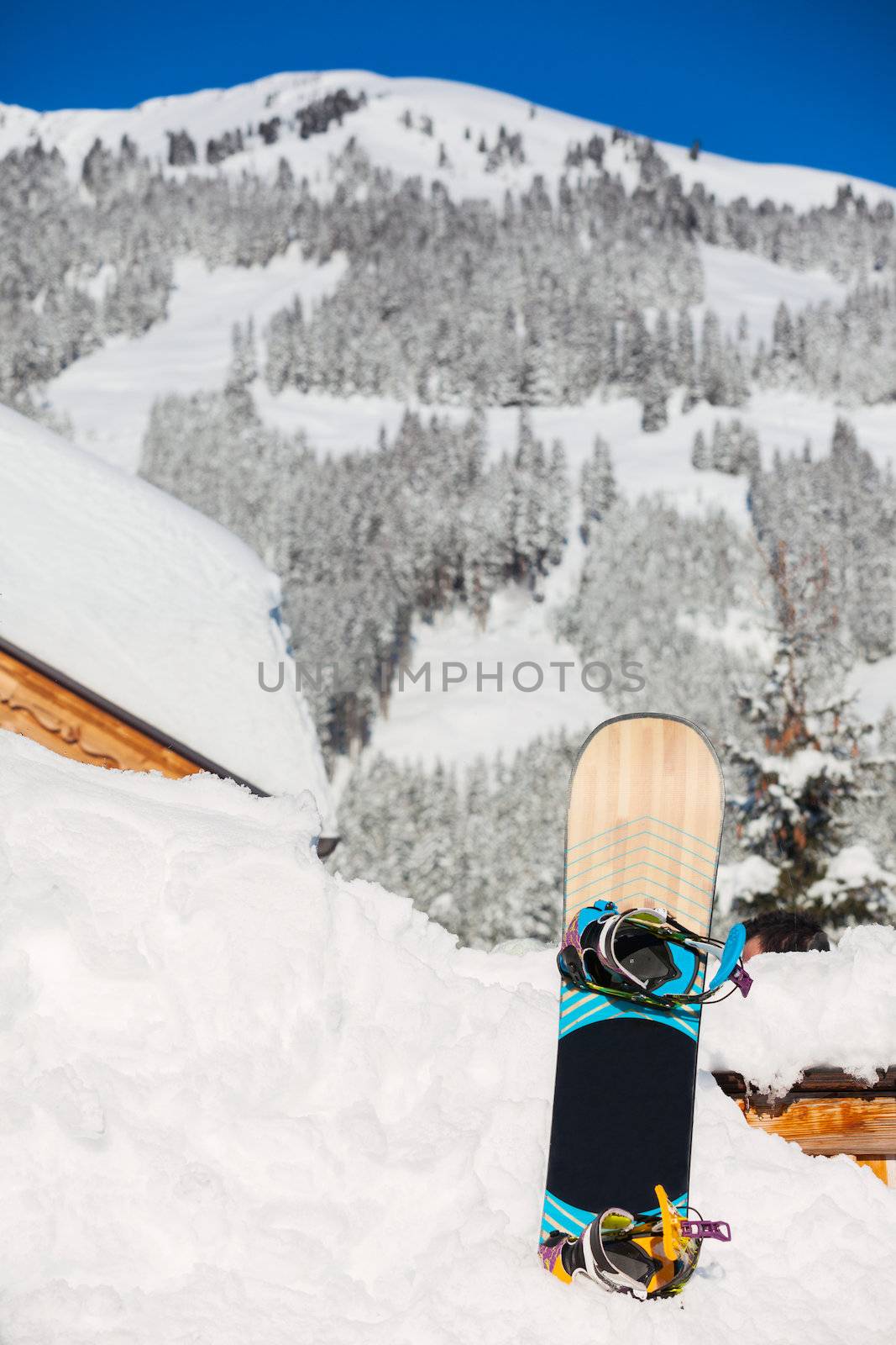 Snowboard stuck in the snow. The Alpine skiing resort in Austria Zillertal