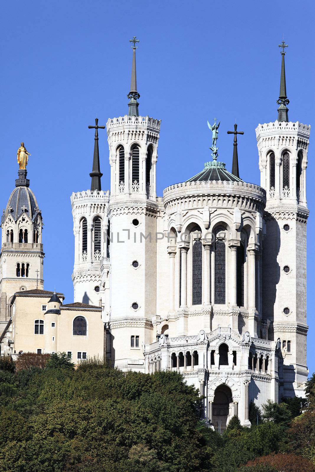 vertical view of Lyon basilica in the big blue sky 