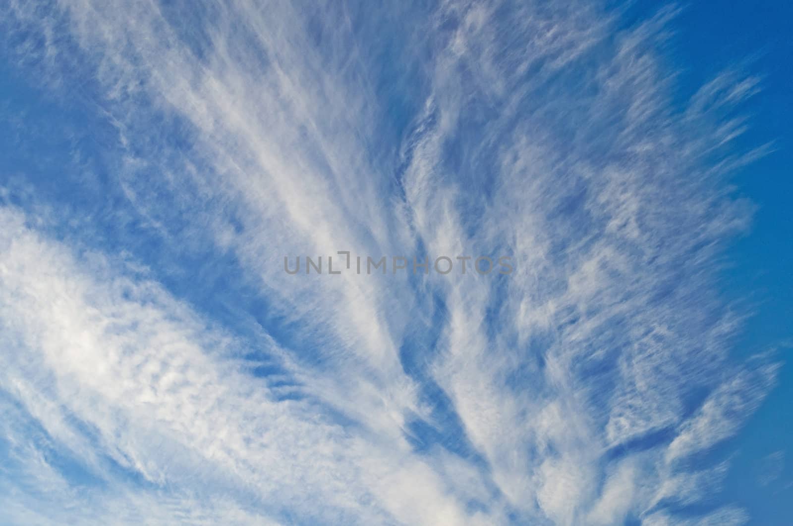 Dramatic white clouds on blue sky background