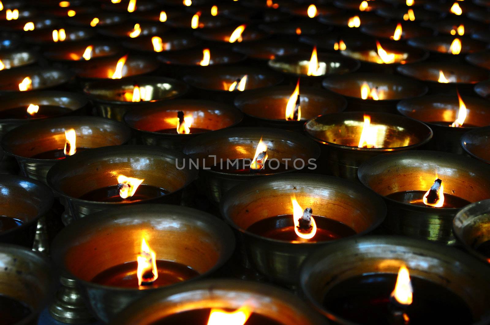 Burning oil lamps in a traditional Chinese ancient temple