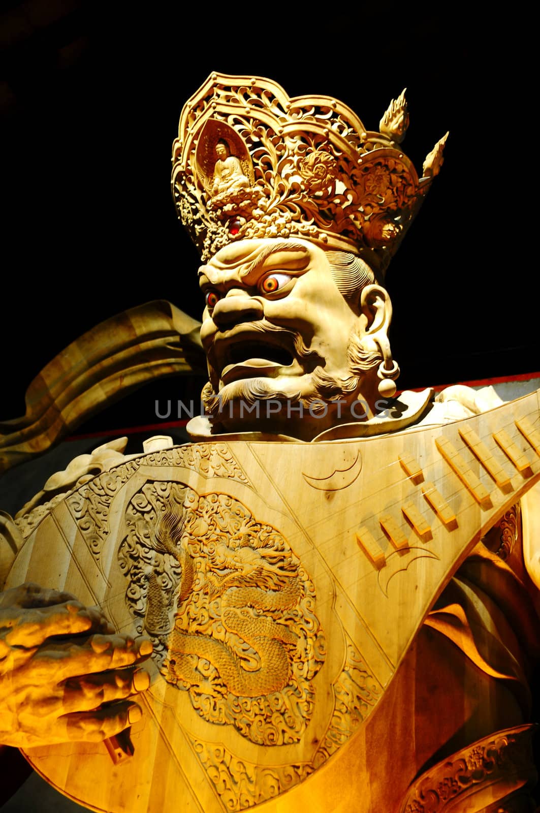 Wood-carving Buddha statue in a traditional Chinese ancient temple