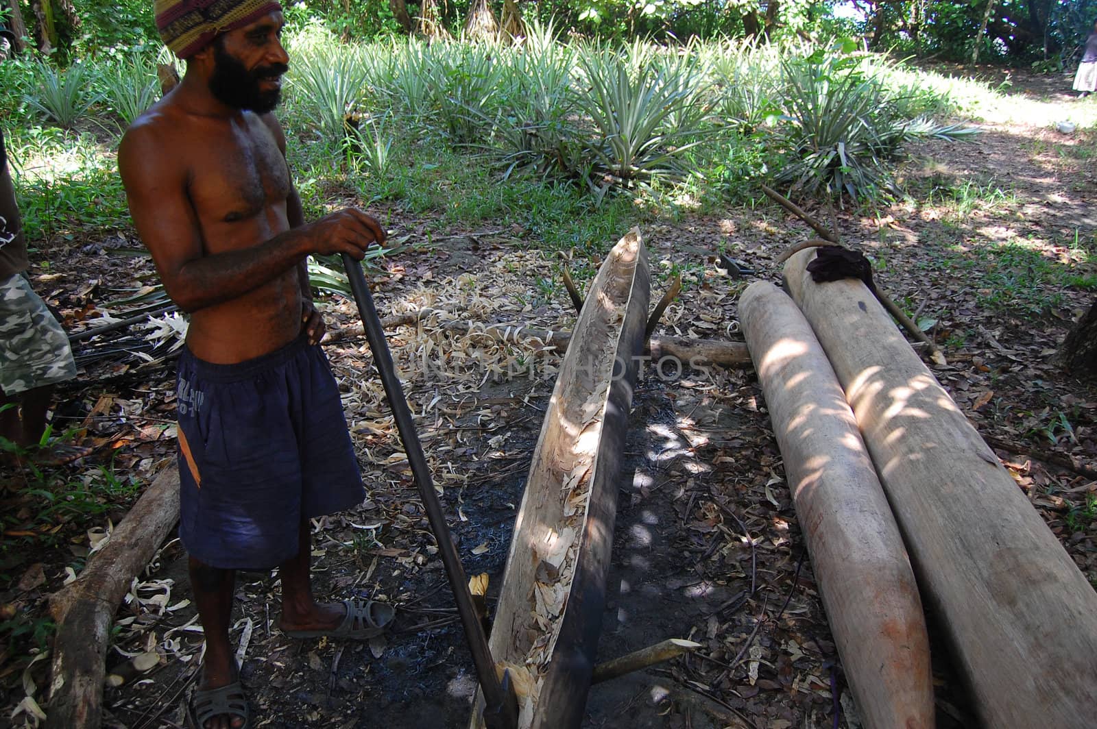 Man builds canoe on 08 of May 2011.
Si-Ini village. Central Province. Papua New Guinea