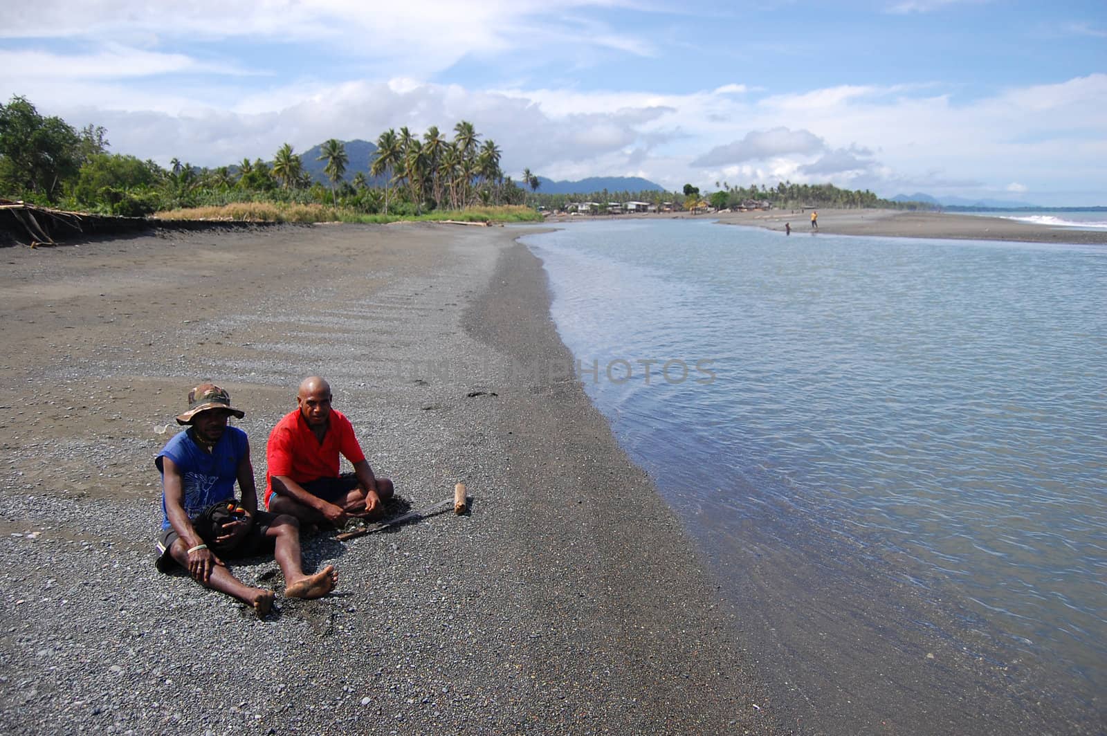 Men sit at beach river coast by danemo