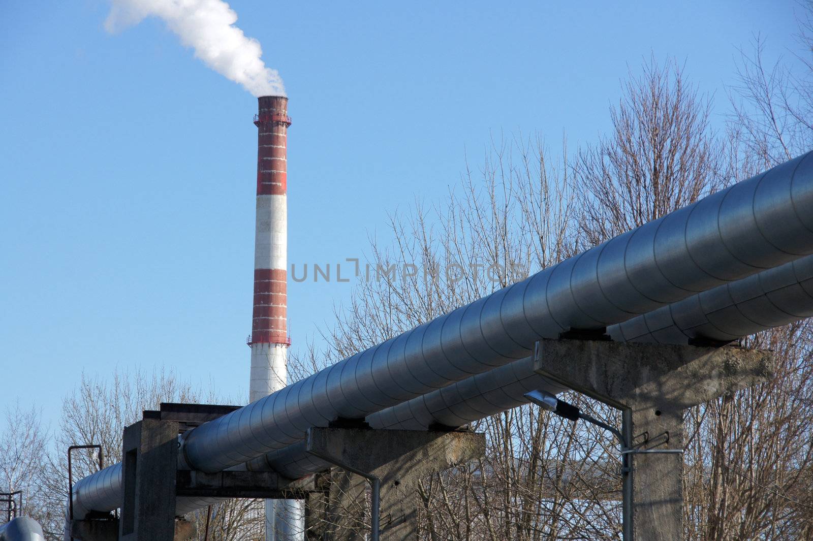 Industrial pipes on a background of the blue sky