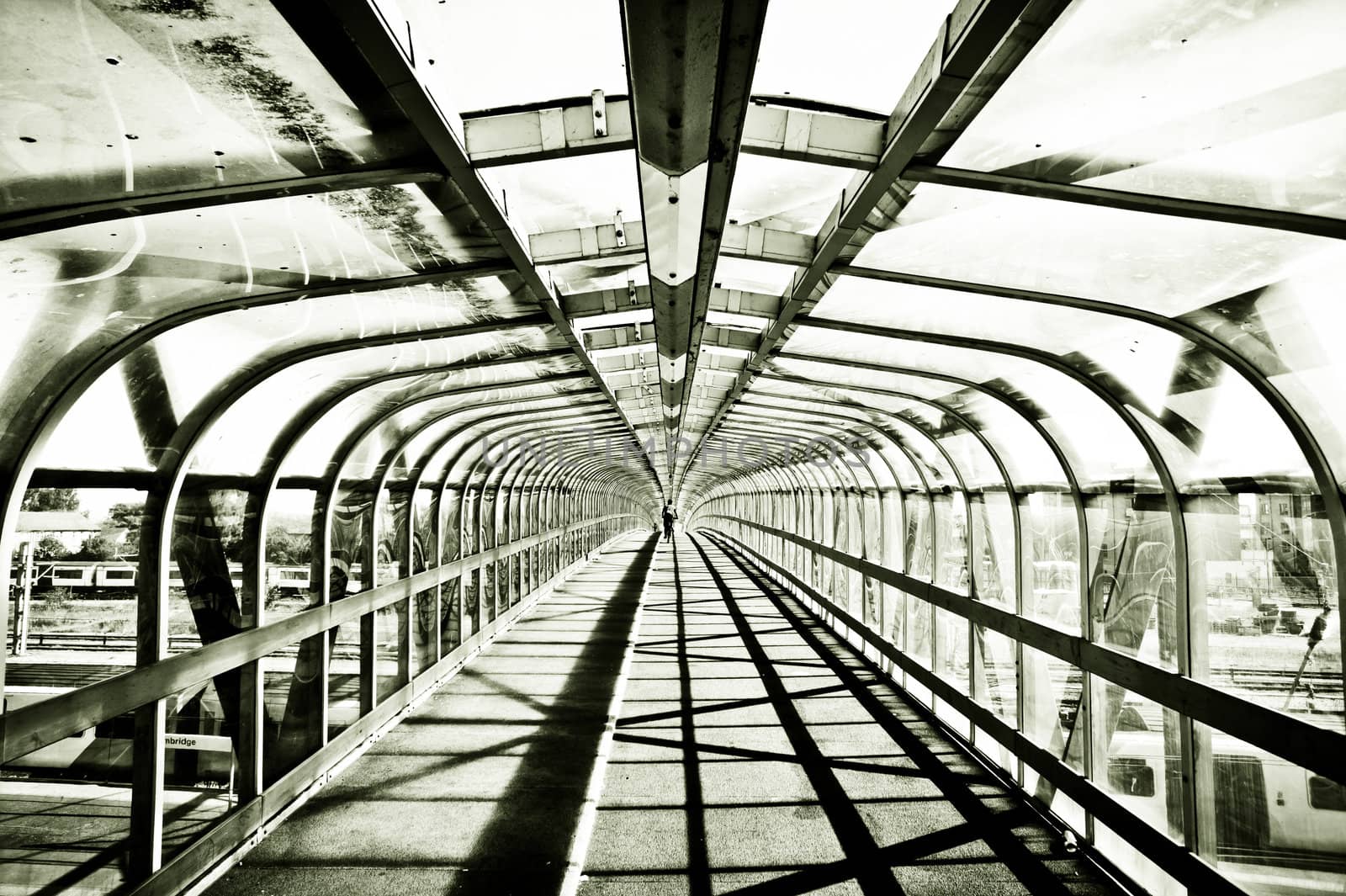 Striking monochrome image of a pedestrian footbridge