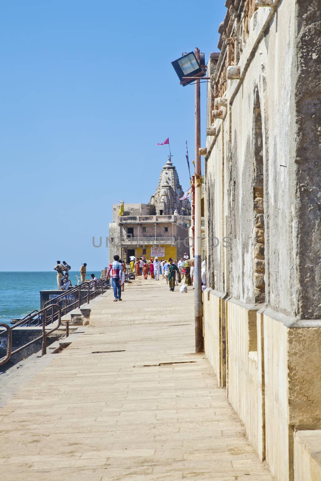 The small Krishna Temple in Dwarka Gujarat India at the corner of the promenade and the beach. Dwarka is a religious and town of historical significance to hinduism