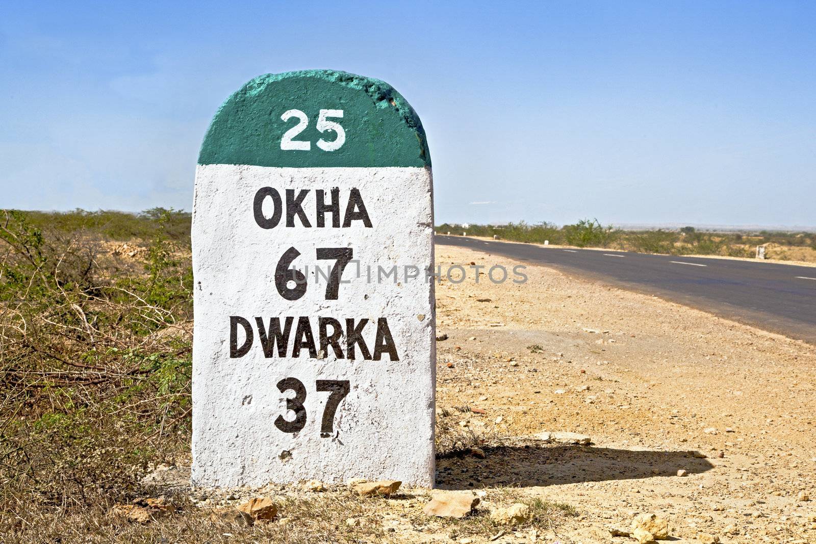 Dwarka Roadtrip. Gujarat India, the 37 kilometers Milestone to Dwarka on the state highway 25 which runs through a barren part of the country