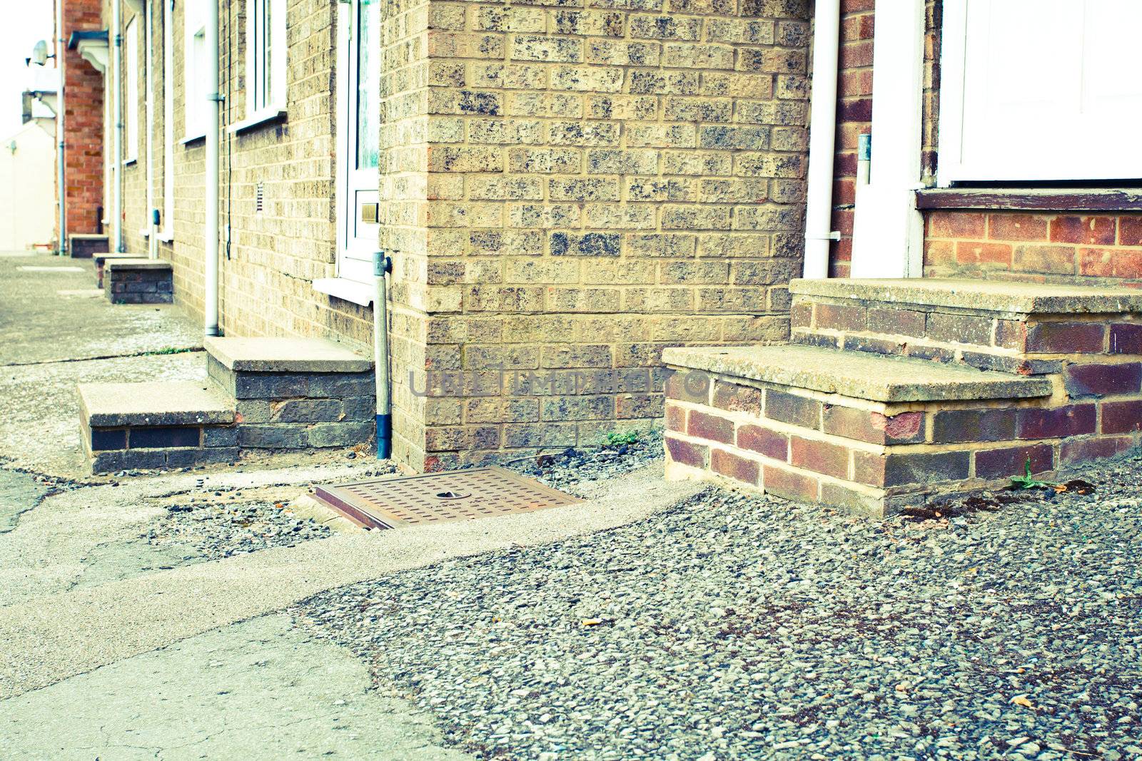 Retro toned image of concrete steps of urban houses