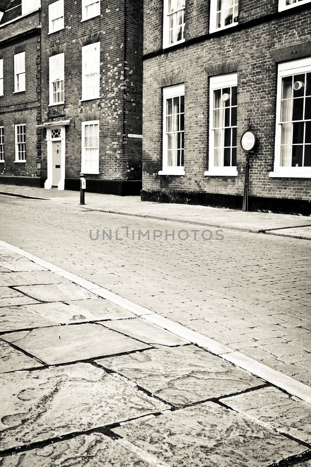 Cobbled street in an English town in monochrome