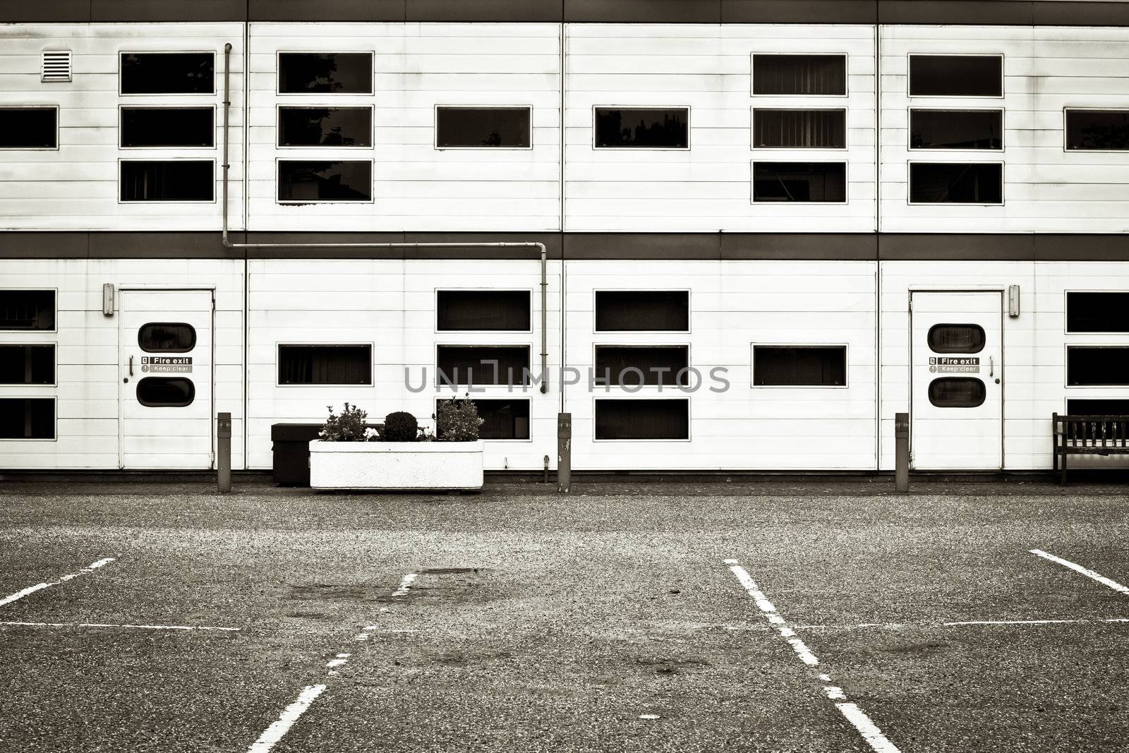 Exterior of a modern warehouse or office block in monochrome