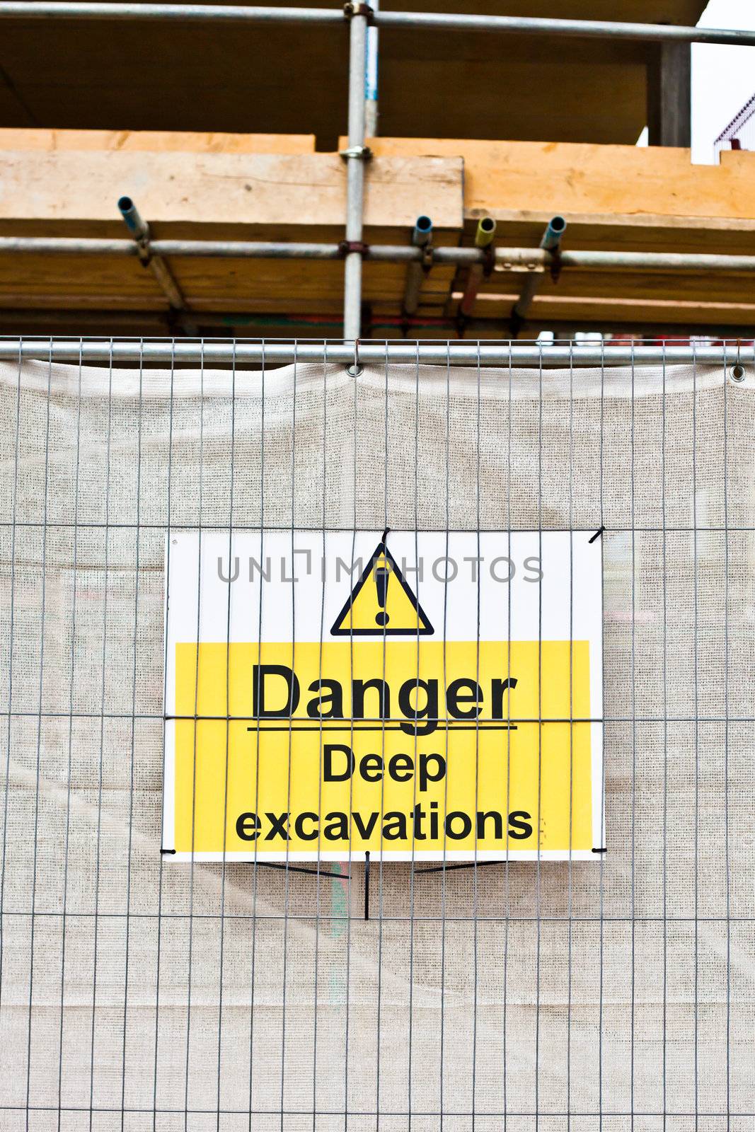 Warning sign about excavations at a construction site