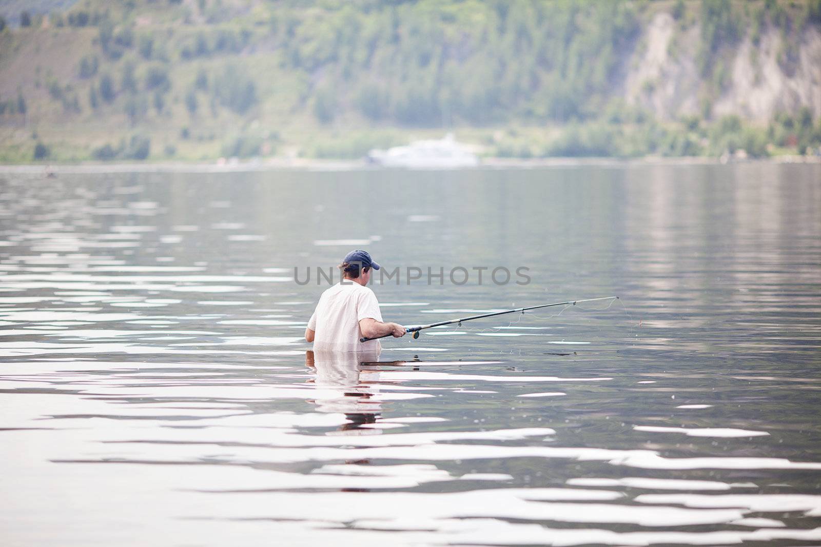 young man fishing in the river