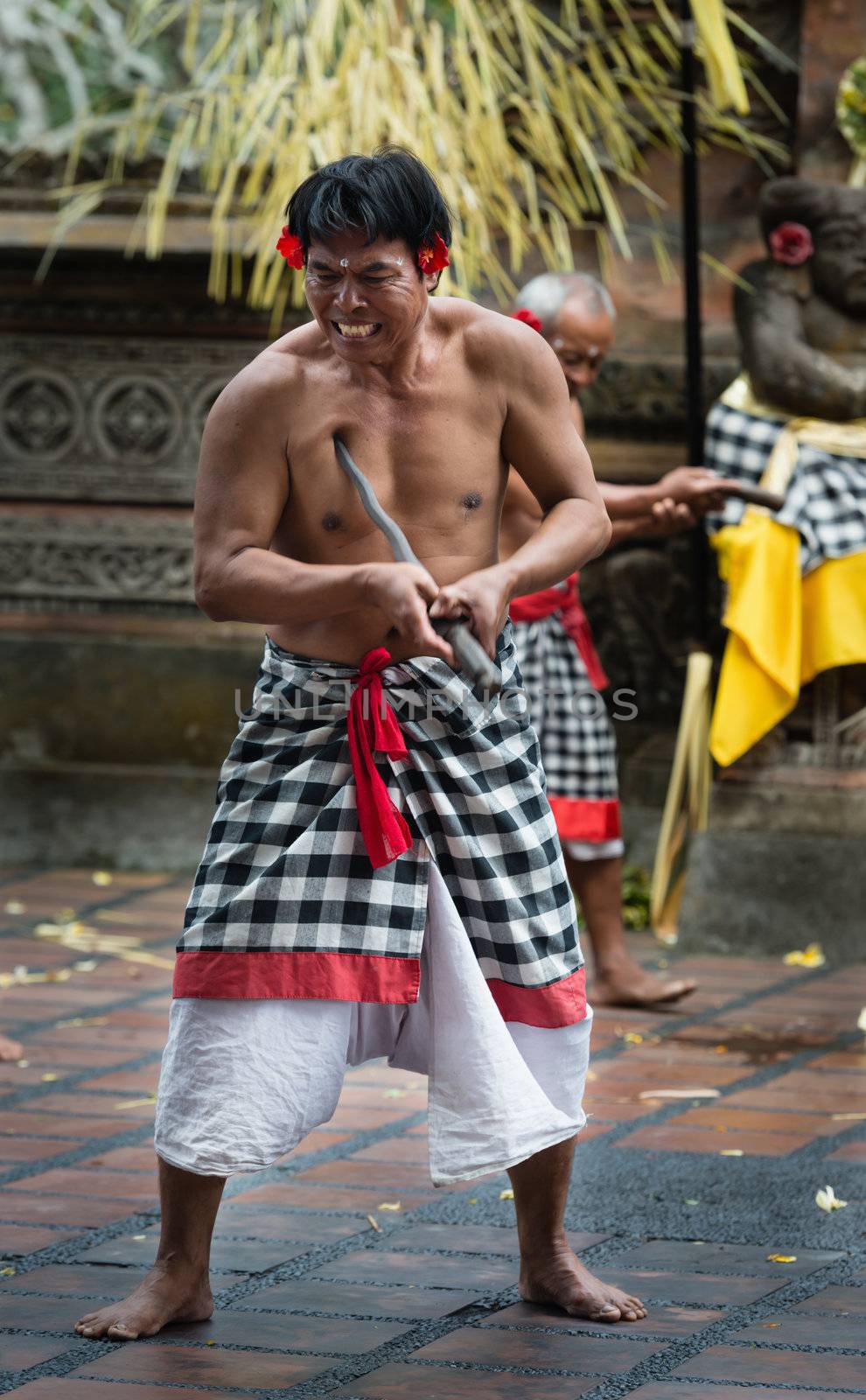 UBUD, BALI, INDONESIA - SEP 21: Kris wielding man performs ritual dance on traditional balinese Barong show on Sep 21, 2012 in Ubud, Bali, Indonesia. The show is popular tourist attraction on Bali