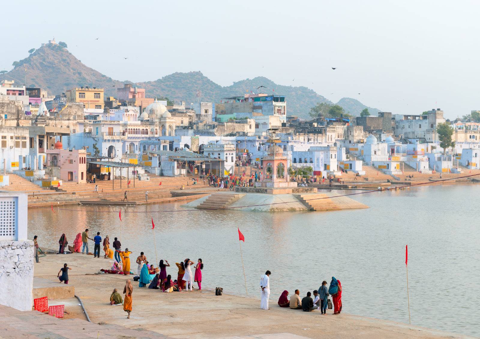 PUSHKAR, INDIA - NOVEMBER 20: Pilgrims take ritual bathing in holy lake on November 20, 2012 in Pushkar, Rajasthan, India. It is one of the five sacred pilgrimage site for devout Hindus.