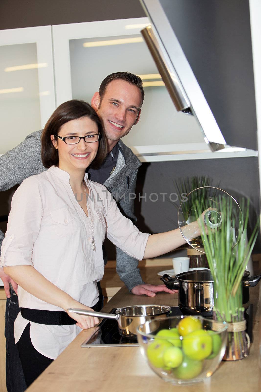 Young couple preparing dinner by Farina6000