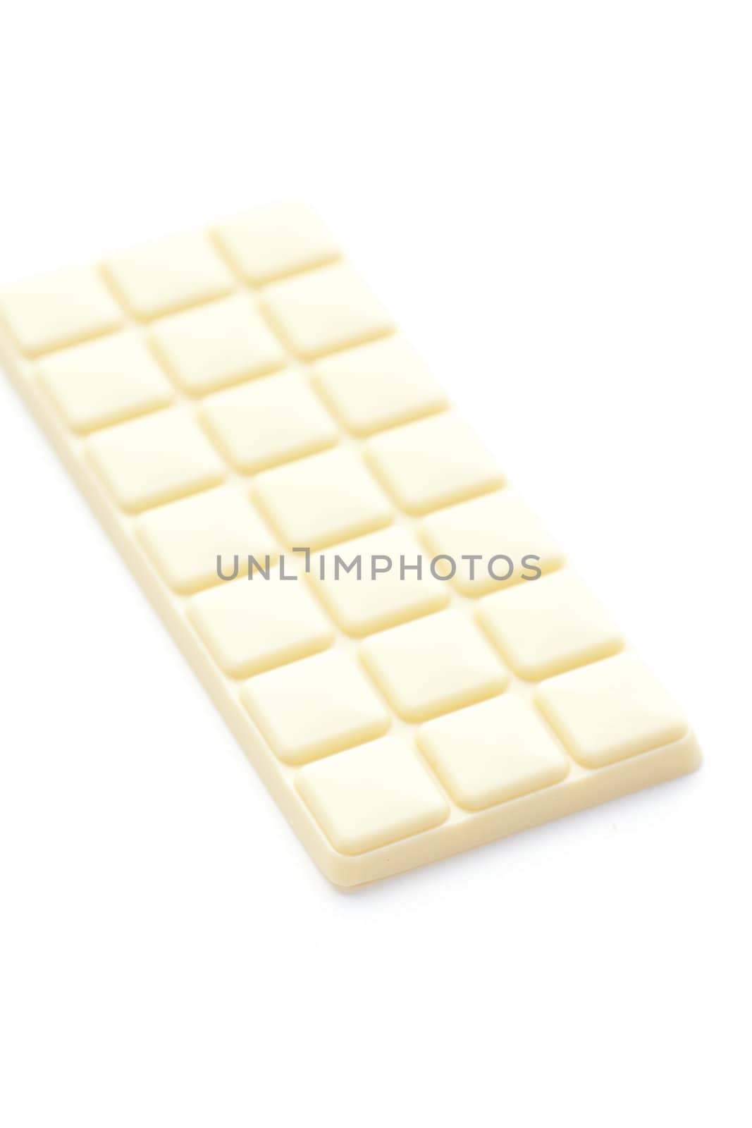 bar of white chocolate isolated on white by jannyjus