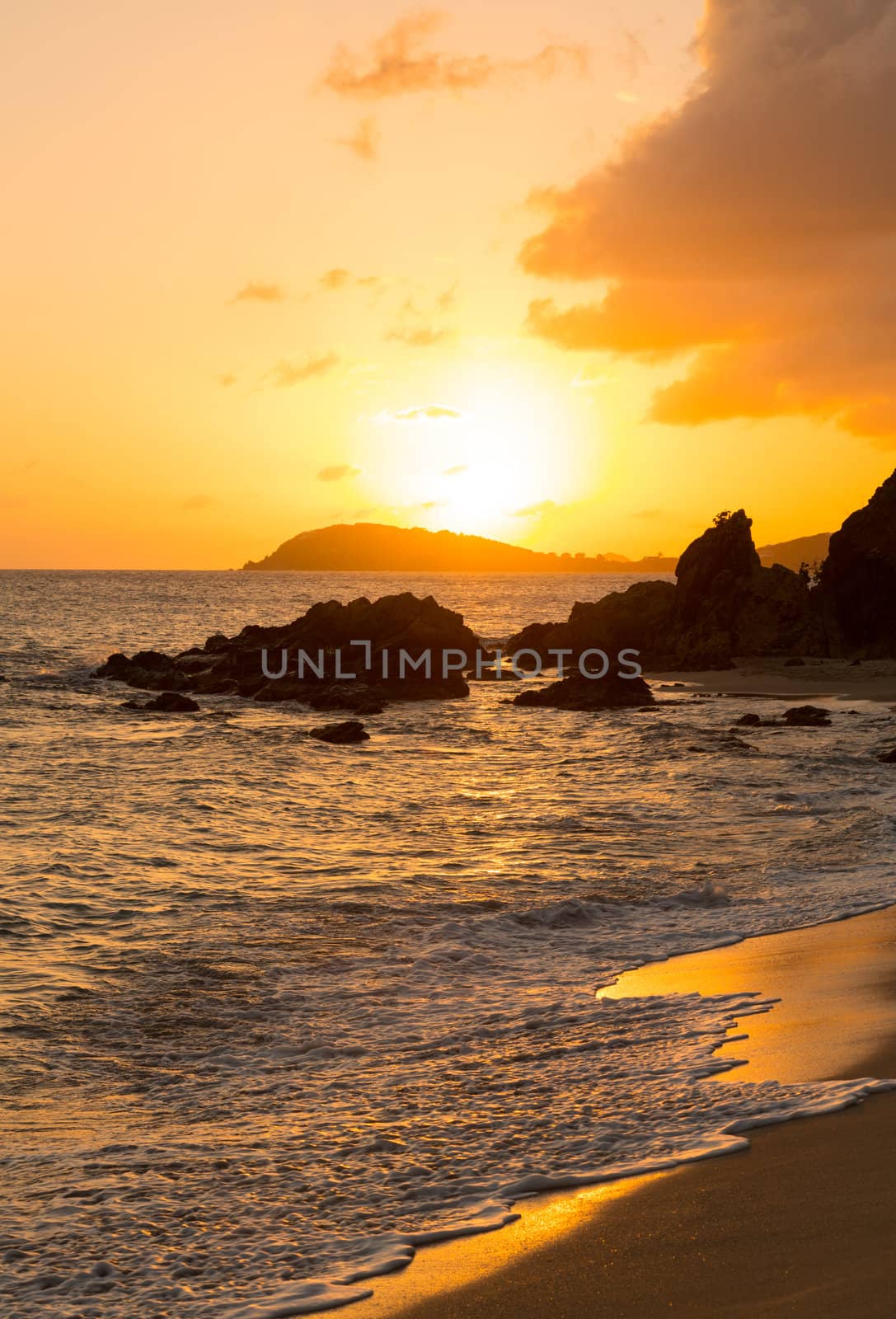 Sun setting over islands by Charlotte Amalie in St Thomas taken from Frenchmans Bay