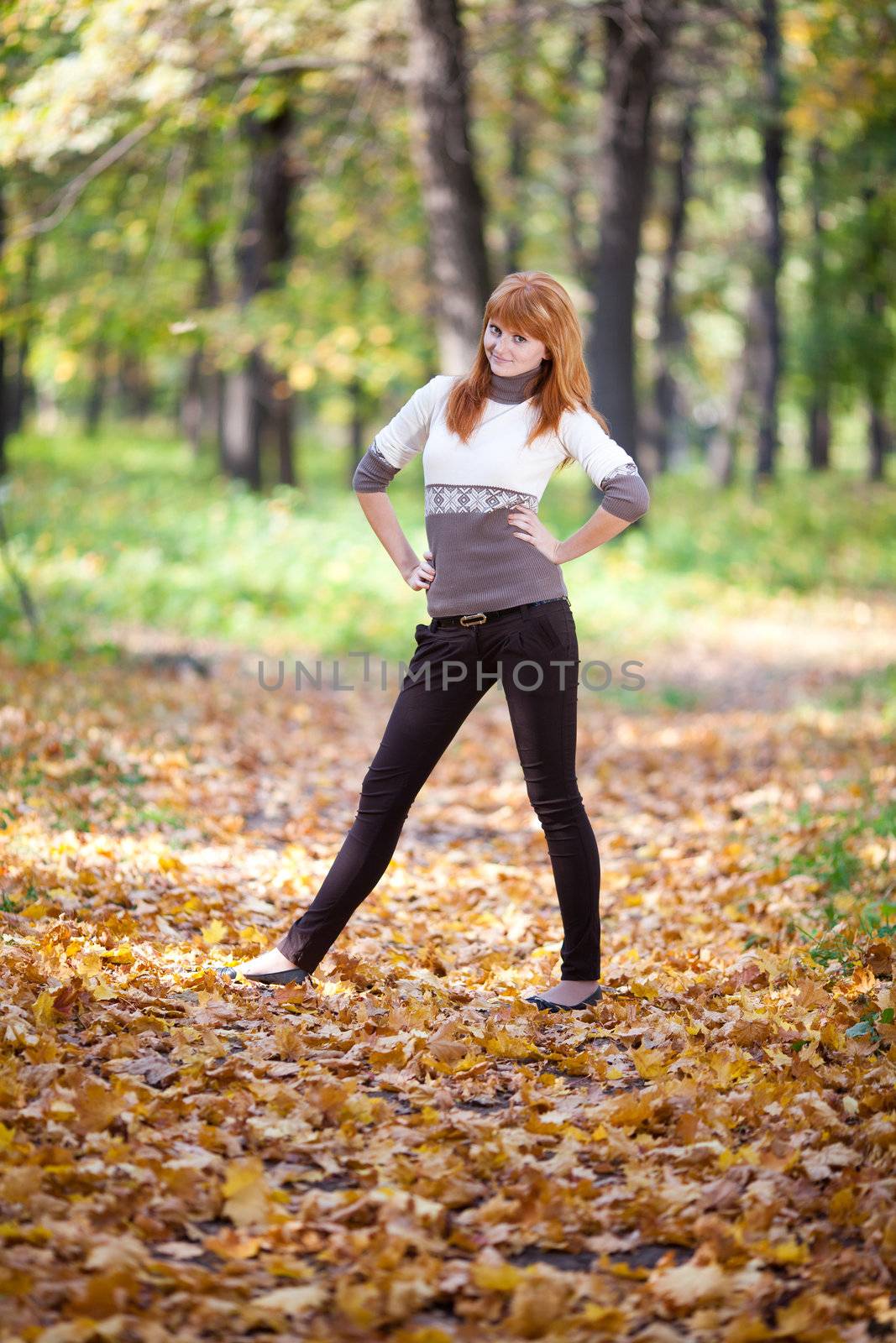 young redhead teenager woman in the forest  