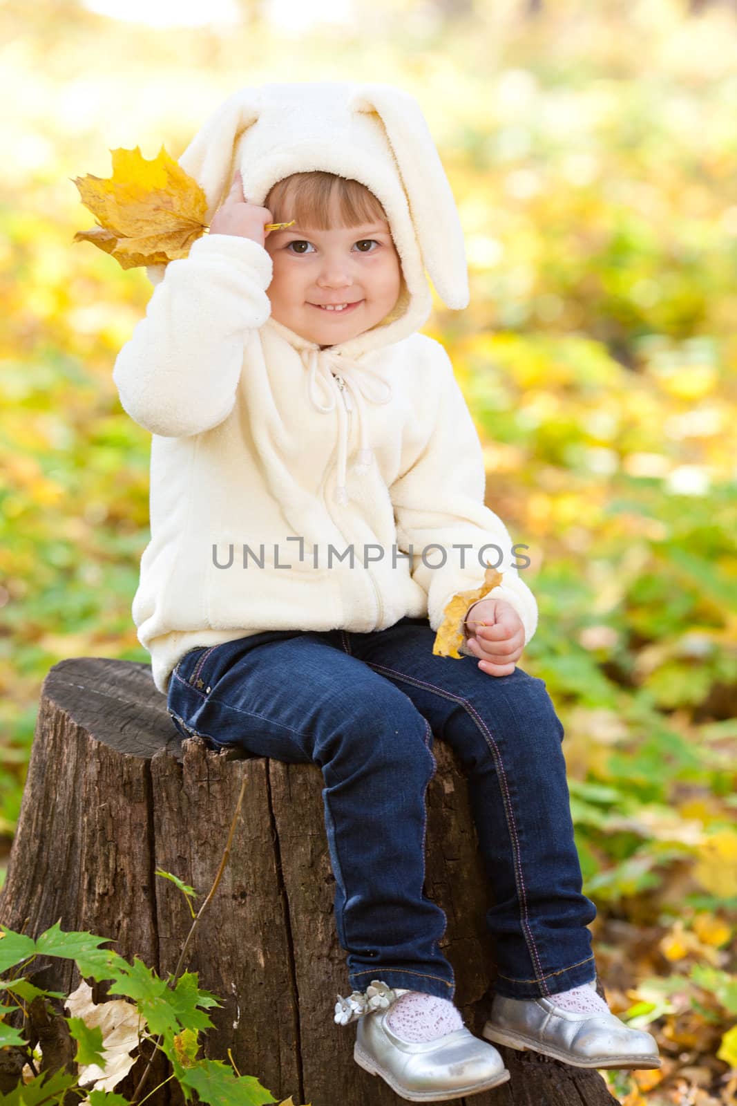 beautiful little girl in costume bunny in the autumn forest by jannyjus