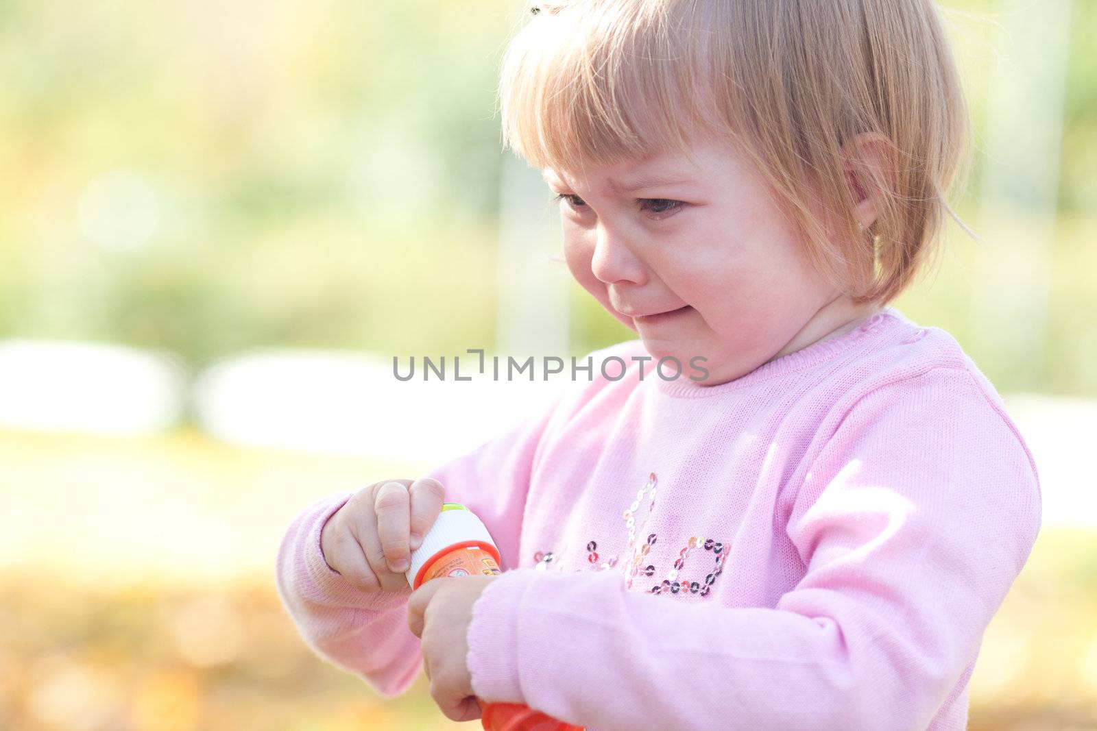 beautiful little girl crying on the autumn forest by jannyjus
